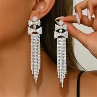 Aretes Double Bow Cascade – Elegancia en Movimiento